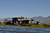 Inle Lake Myanmar. All the buildings are constructed on piles. Residents travel around by canoe, but there are also bamboo walkways and bridges over the canals, monasteries and stupas. 